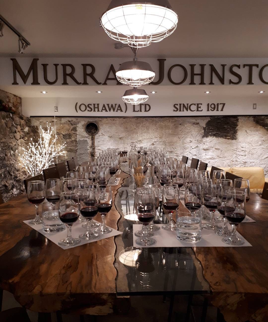 The party room set for a group, wine glasses down the long table